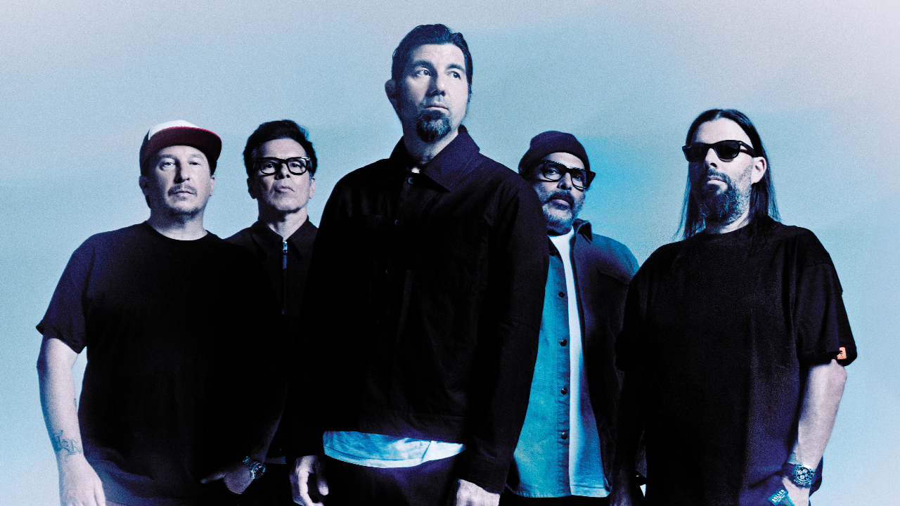 Deftones looking serious against a light blue backdrop
