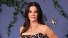 Sandra Bullock is pictured wearing a leopard print dress at the "Practical Magic 2" European Premiere at Odeon Luxe Leicester Square on August 26, 2026 in London, England