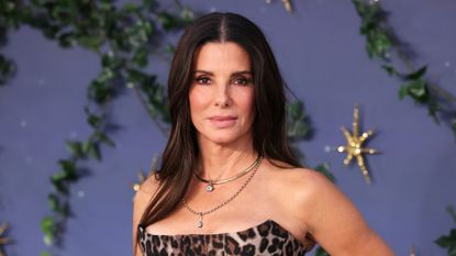 Sandra Bullock is pictured wearing a leopard print dress at the "Practical Magic 2" European Premiere at Odeon Luxe Leicester Square on August 26, 2026 in London, England