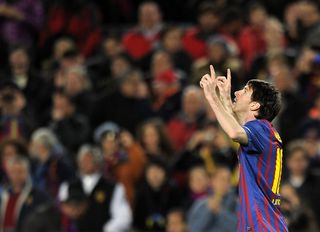 Lionel Messi celebrates after scoring one of his five goals in a 7-1 win for Barcelona over Bayer Leverkusen in the Champions League in March 2012.