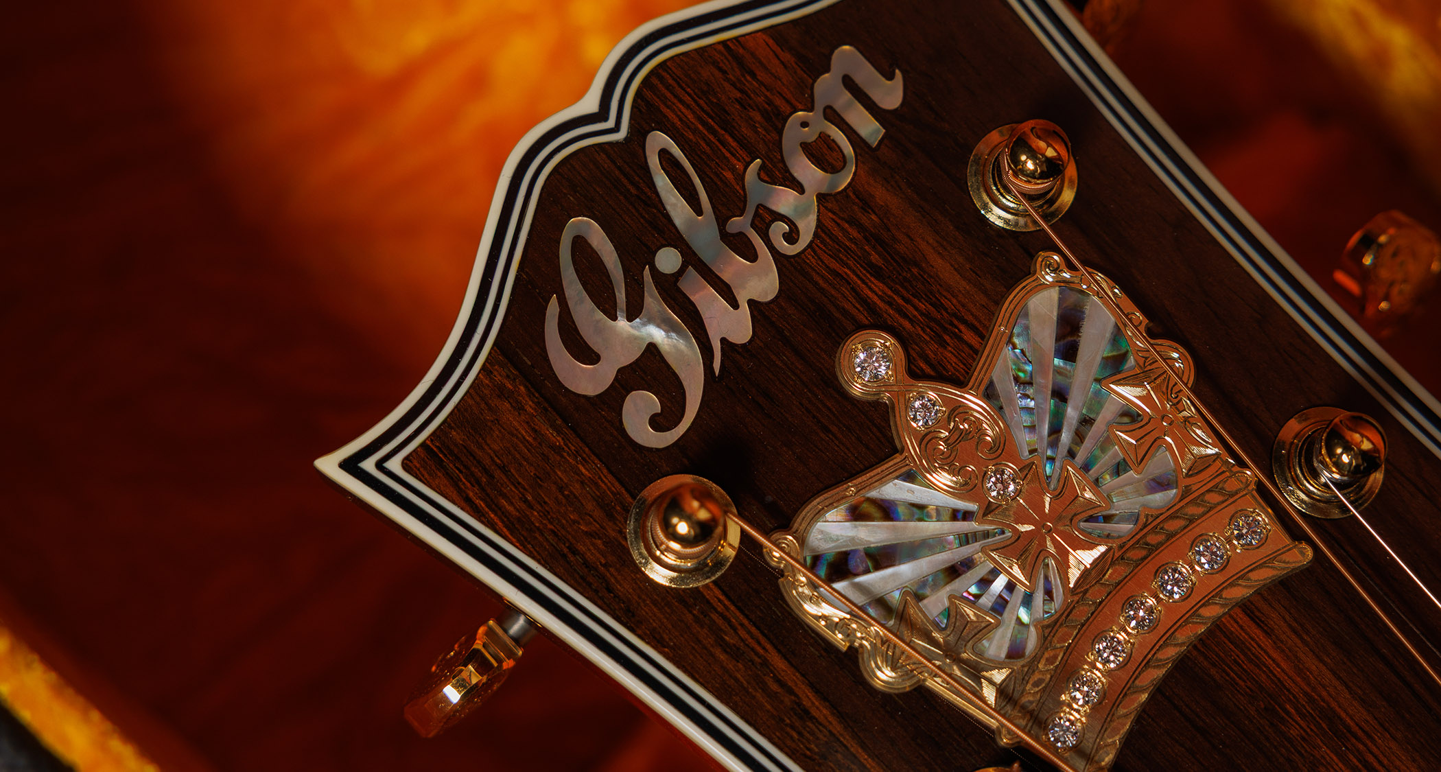 Gibson Custom SJ-200 Monarch #100: this stunning one-of-one jumbo is replete with all kinds of rococo flourishes, from the diamond and gold crown inlay on the headstock, to the 14k gold rope binding, Gibson calls it the "ultimate custom" acoustic and not without some justification.