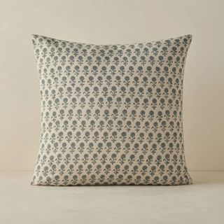 blue and cream patterned cushion