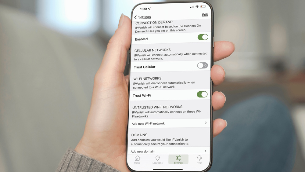 IPVanish's VPN settings menu on a smartphone being held by a person.