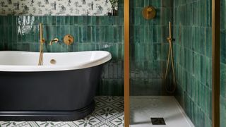 green bathroom with tiles and toile wallpaper showing 2 key bathroom trends