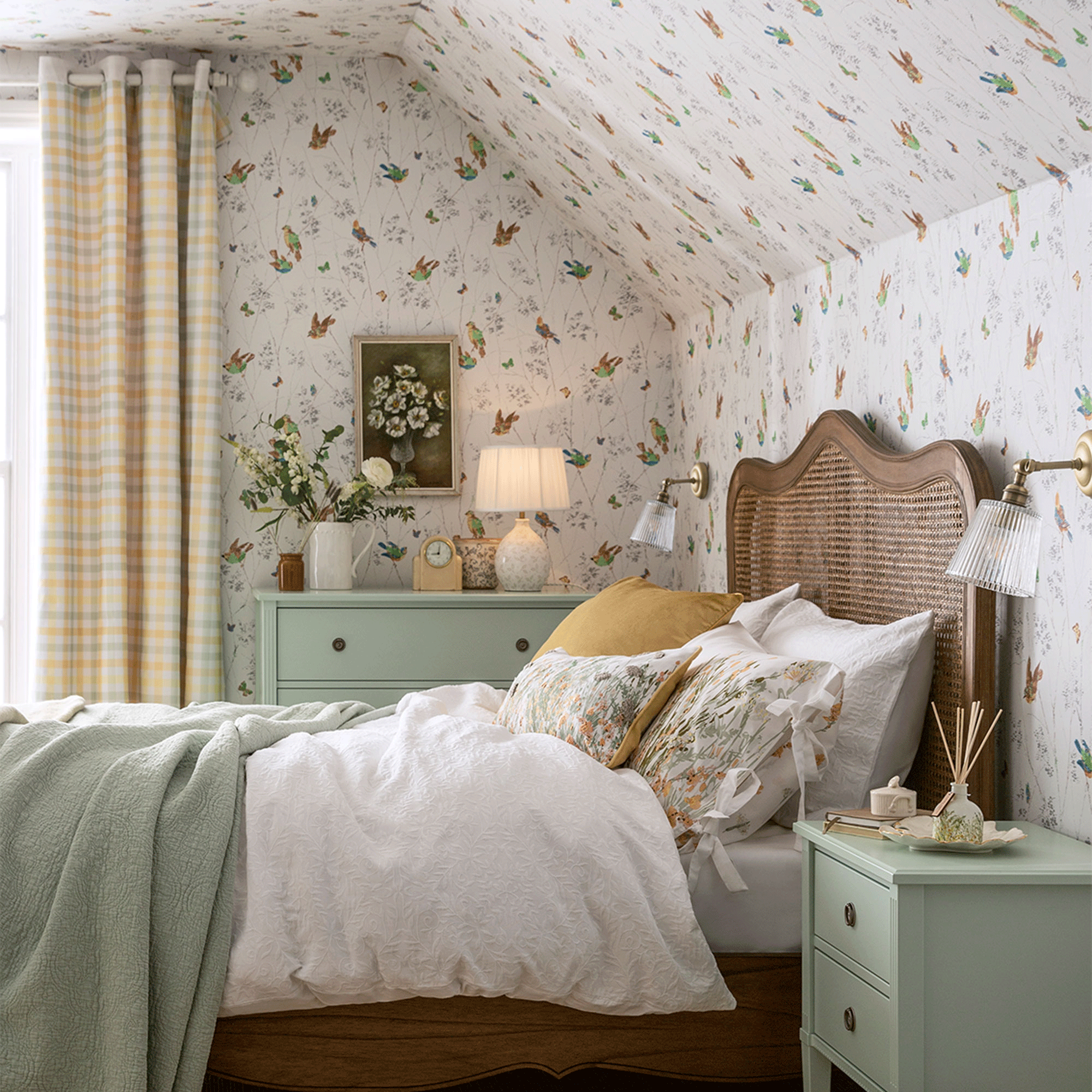 Wallpapered ceiling with floral pattern and rattan bed