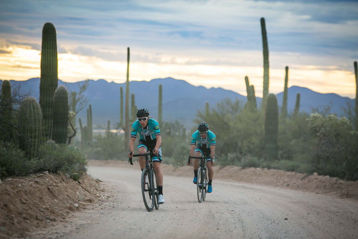 Travis McCabe and Nick Zukowsky train in the Floyd's Pro Cycling 2019 team kit