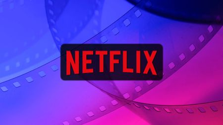 Netflix logo on a blue pink film reel background