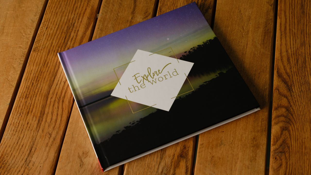 A photobook from CEWE on a desk
