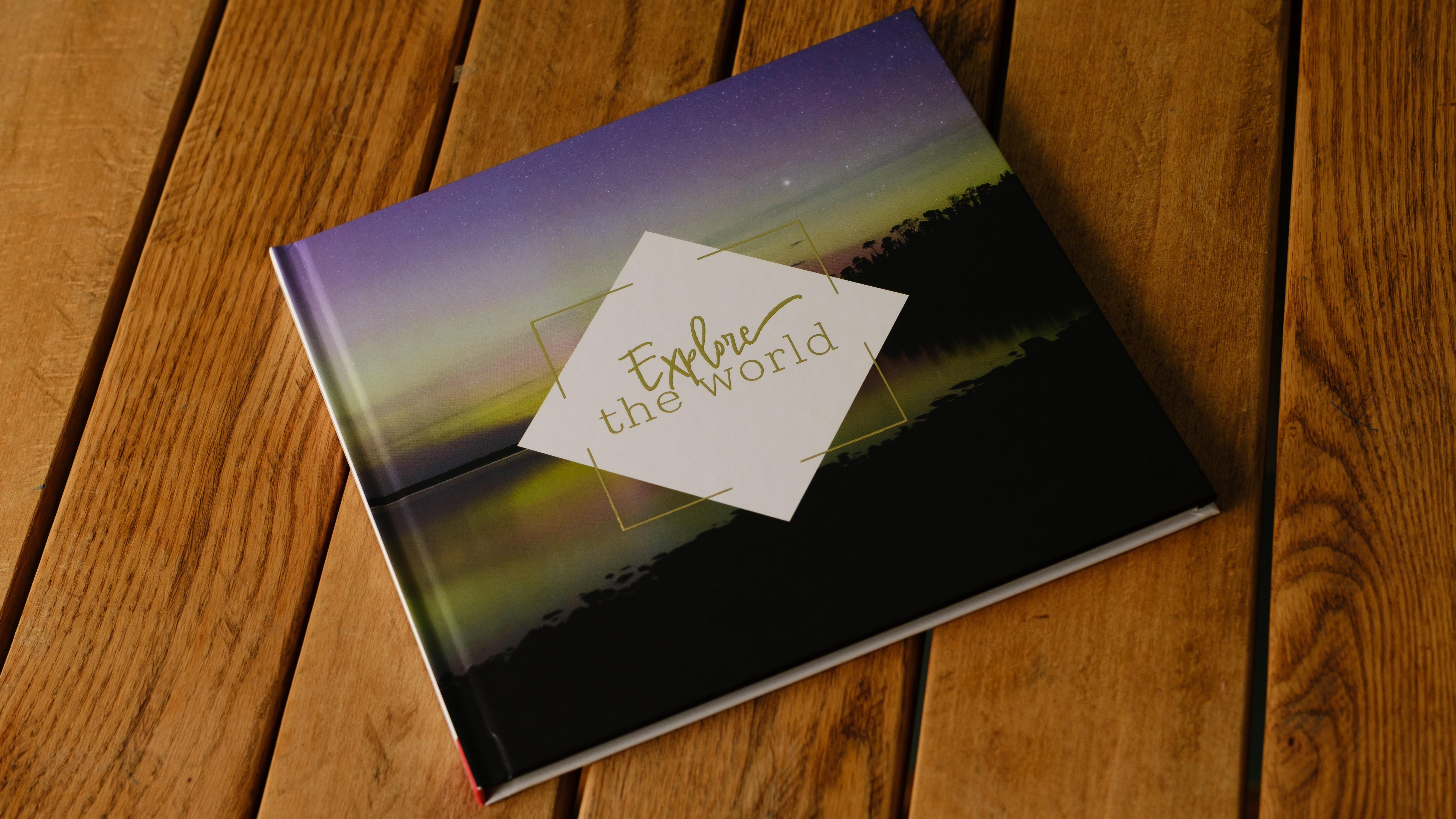 A photobook from CEWE on a desk