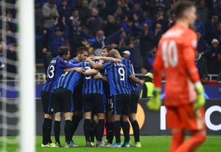 Atalanta players celebrate a goal against Dinamo Zagreb at San Siro in the Champions League in November 2019.