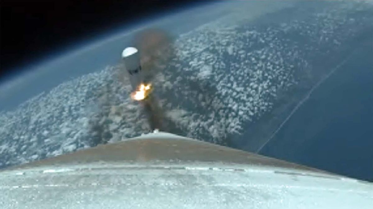 A strap-on rocket booster separates from ULA's Atlas V rocket during the SBIRS GEO Flight 5 satellite launch.
