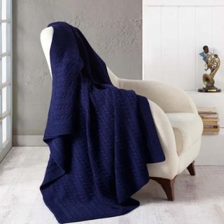 navy wool blanket from wayfair on a white chair