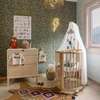 kids room with floral printed wallpaper on wall and white window