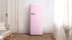 Pink SMEG fridge in open room