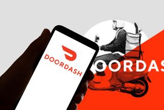 In this photo illustration the logo of the food delivery service Doordash is seen on the screen of mobile phone and in the background
