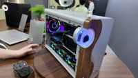 Amiiba Ferra pc case on a wooden desk