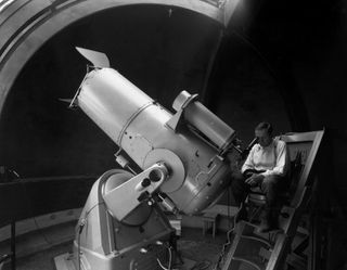 Fritz Zwicky at the 18-inch Schmidt telescope at Palomar Observatory in the 1930s. Zwicky did extensive work looking for variable objects, and identified over 100 supernovas in his lifetime.