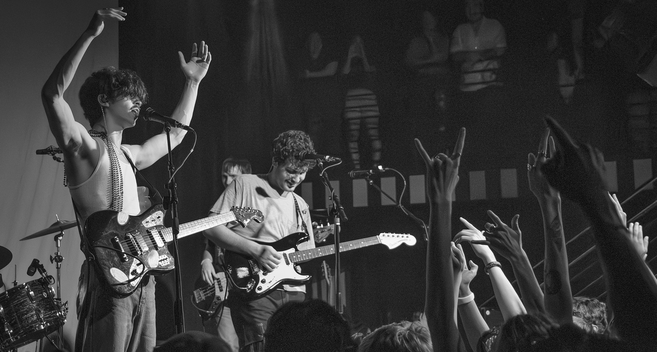 A black-and-white live shot of Phoneboy&#039;s Ricky Dana [left] and Wyn Barnum in front of a fired-up crowd.