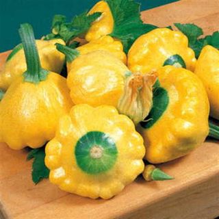 A pile of yellow and green pattypan squash