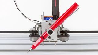 Best pen plotter; a red pen in a pen plotter machine