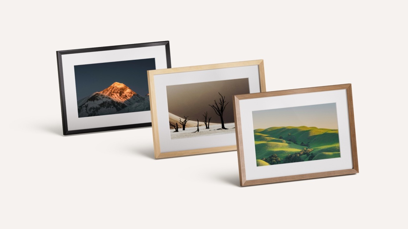 The Amazon Alexa Photo Frame in black, and real Birch and Walnut wood finishes.