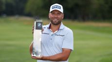 Dan Brown poses with the BMW International Open trophy after winning in 2025