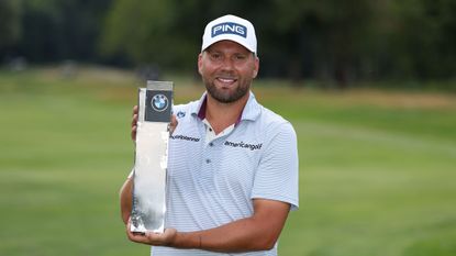 Dan Brown poses with the BMW International Open trophy after winning in 2025