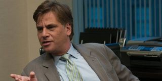 Aaron Sorkin with hand held out
