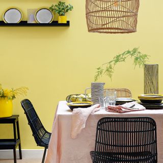 room with yellow coloured and dining table