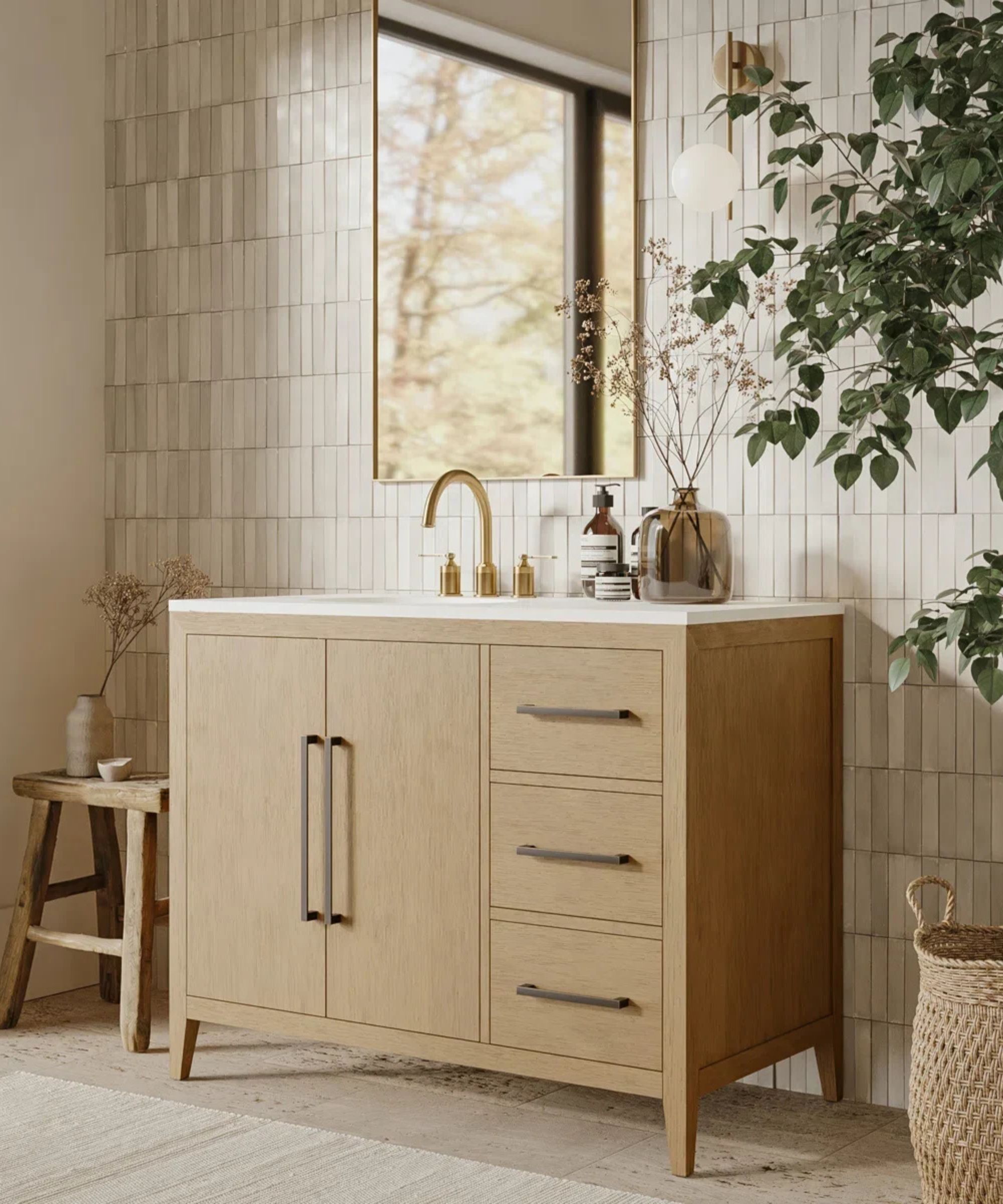A neutral bathroom with beige wall tiles, a wooden vanity, and a faux olive tree