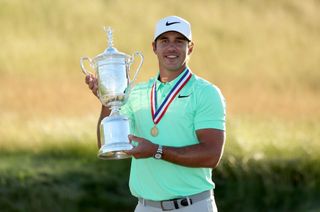 Brooks Koepka holding the US Open trophy