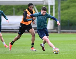 Chido Martin Obi and Declan Rice of Arsenal during a training session at Sobha Realty Training Centre on April 08, 2024 in London Colney, England.