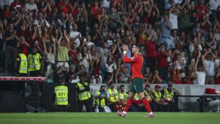 Portugal's Cristiano Ronaldo applauding fans while leaving the pitch