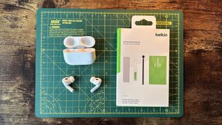Belkins AirPods cleaning kit, with AirPods Pros and parts exposed.