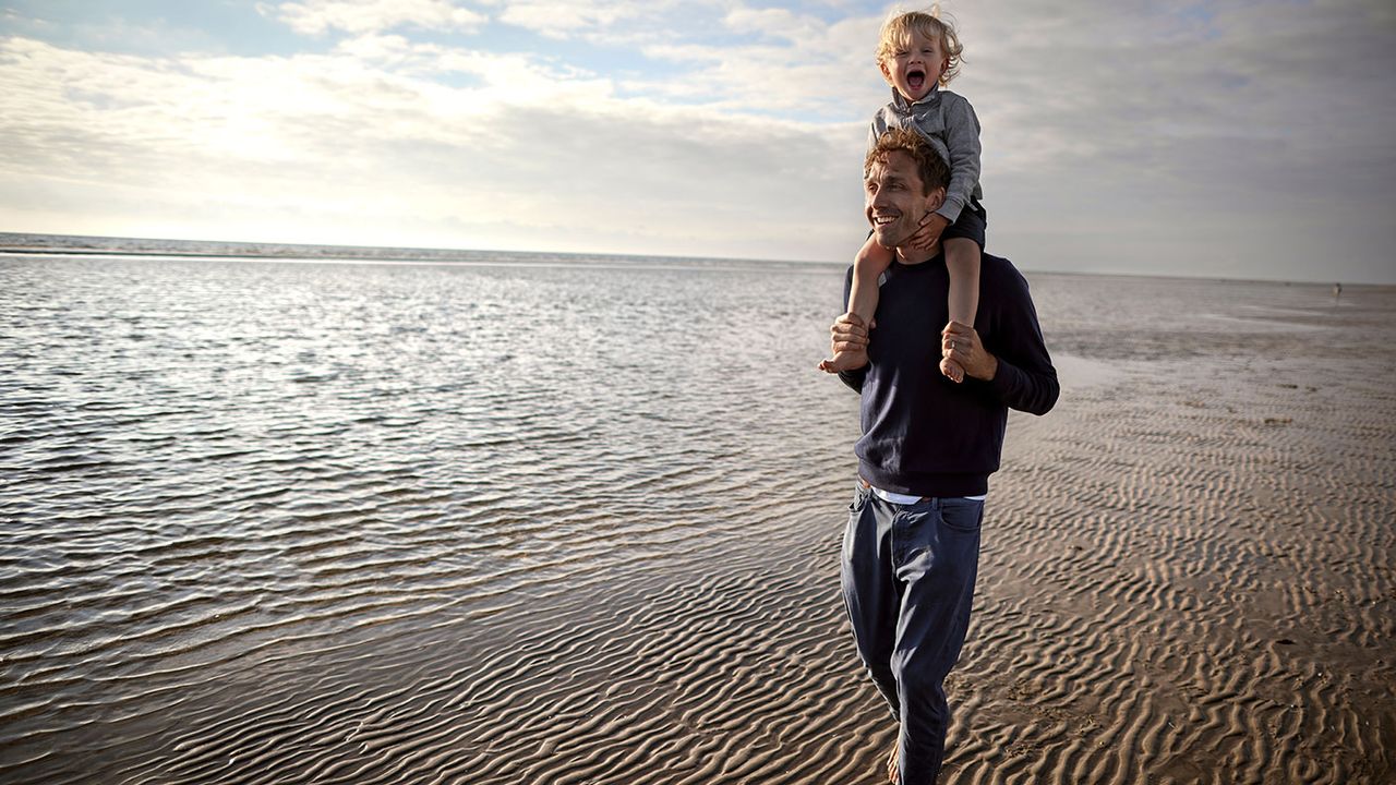 A man with a child on his shoulders