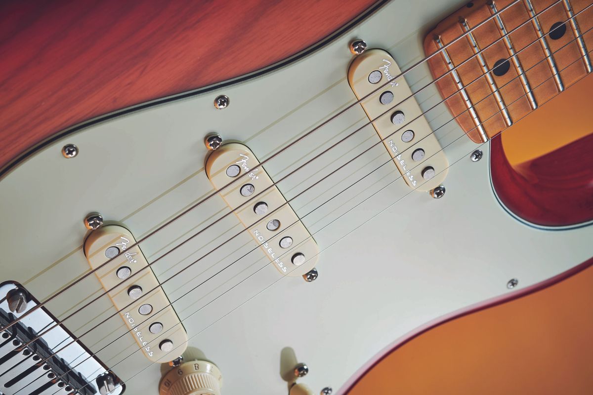 These are the fifth iteration of Fender's Noiseless stacked single-coil pickups. By the fourth generation, found on the Elite series, shielded wire was used for even more effective noise reduction, along with higher output Alnico 5 magnets