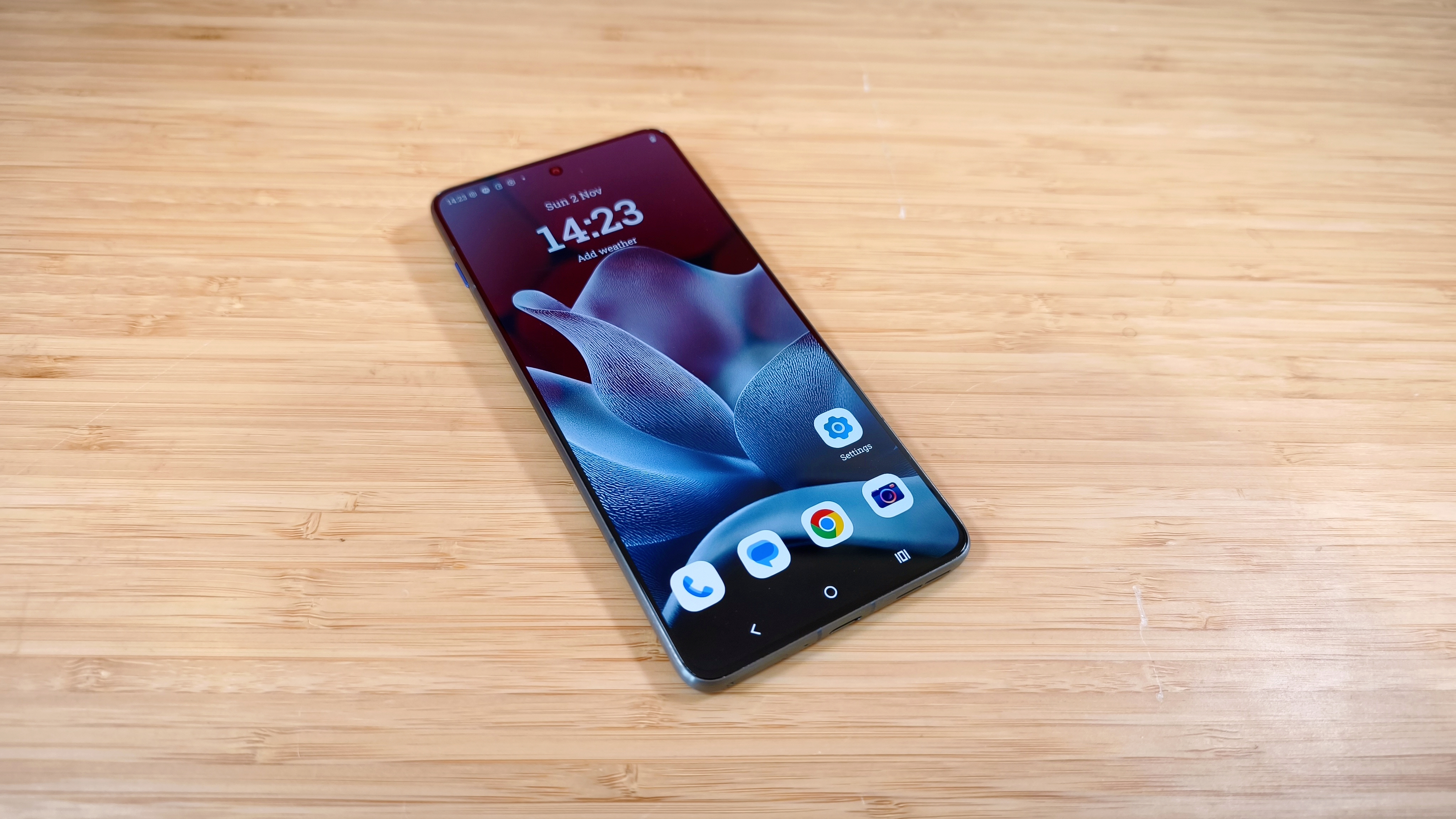 Motorola Edge 70 phone on a wooden desk