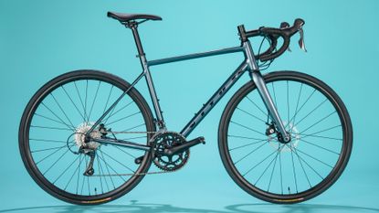 Vitus Razor Disc Road Bike Claris on a blue background