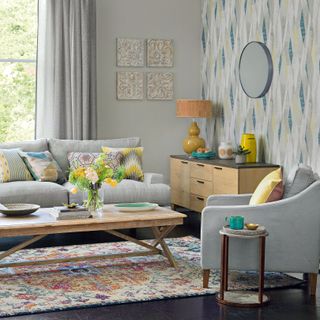 Light grey living room with accents of blue green