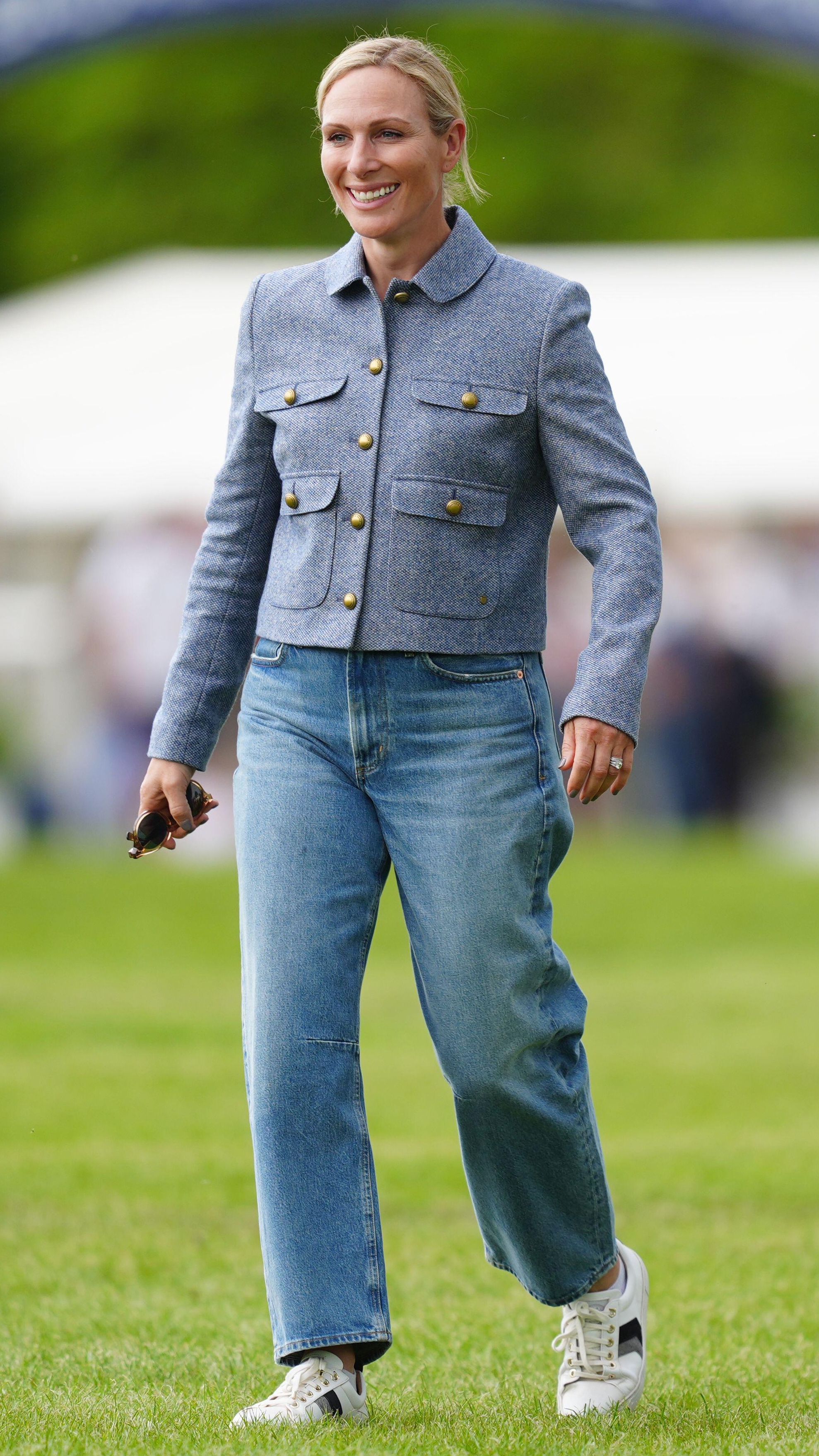 Zara Tindall walks across grass as she attends the Badminton Horse Trials 2025