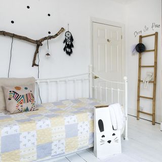 childrens room with white walls and ladder