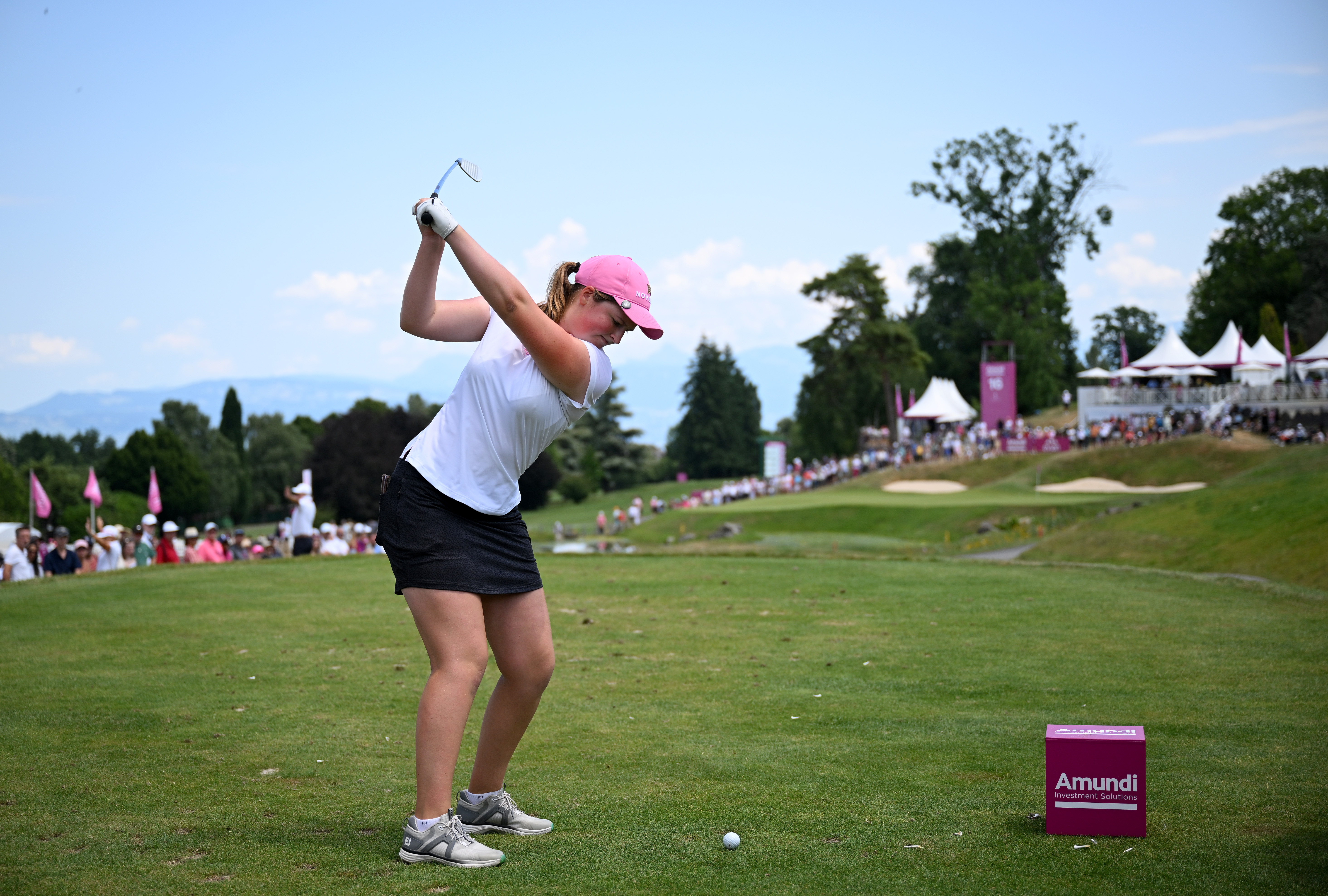 Lottie Woad at the top of her back swing