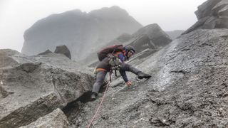 Anna Taylor climbs Cioch Nose on Skye in wet weather