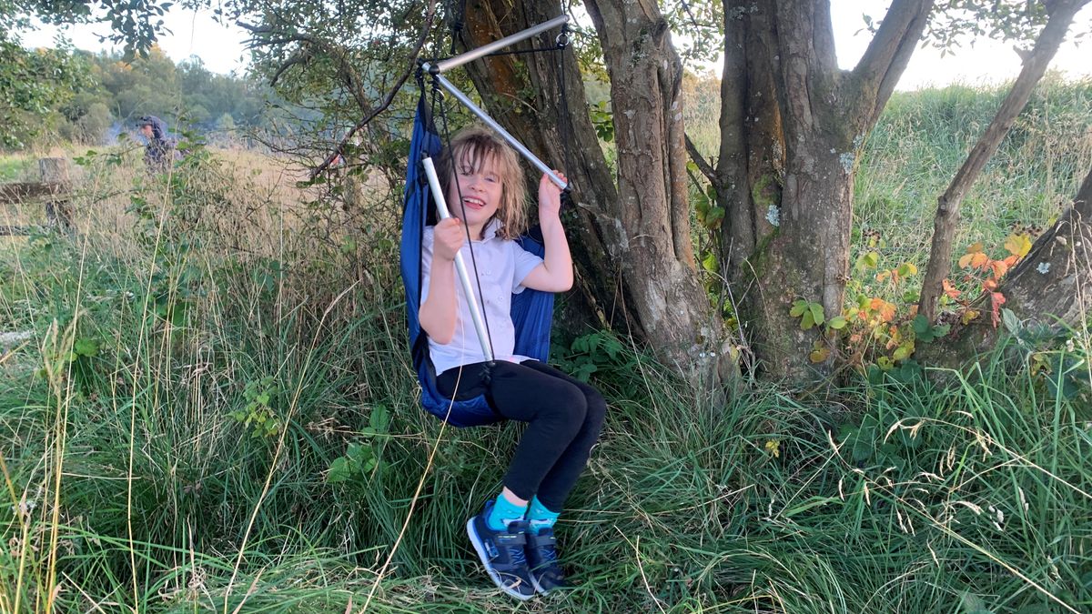 Child swinging in the Ticket to the Moon Moonchair