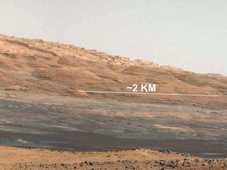 This image (cut out from a mosaic) shows the view from NASA's Mars rover Curiosity landing site toward the lower reaches of Mount Sharp, where the rover will likely start its ascent through hundreds of feet (meters) of layered deposits. Image taken on Aug. 8, 2012, released Aug. 17.