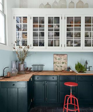 Light blue kitchen with dark green lower cabinets