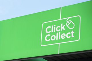 A green sign that reads "Click and collect" with a computer mouse in place of the "and"