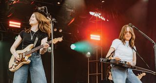 Larkin Poe perform onstage at the inaugural Extra Innings Festival in Tempe, Arizona, back in March 2024 