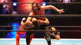 AEW wrestler Jay White grapples with an opponent in the ring ahead of the AEW Full Gear 2023 live stream 