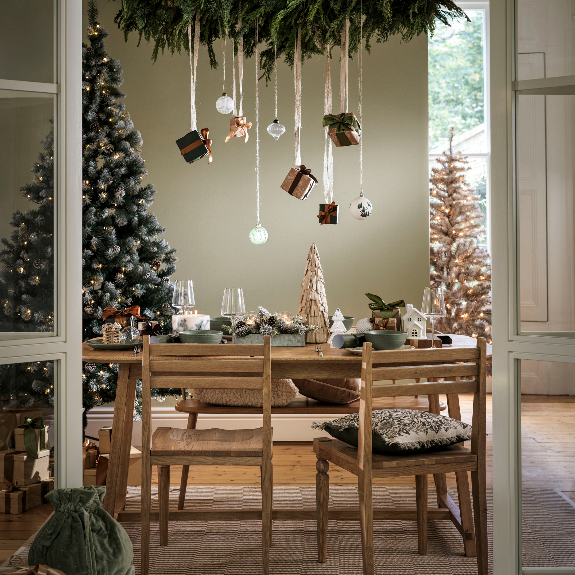 Habitat inclusion candle on a Christmas tablescape.